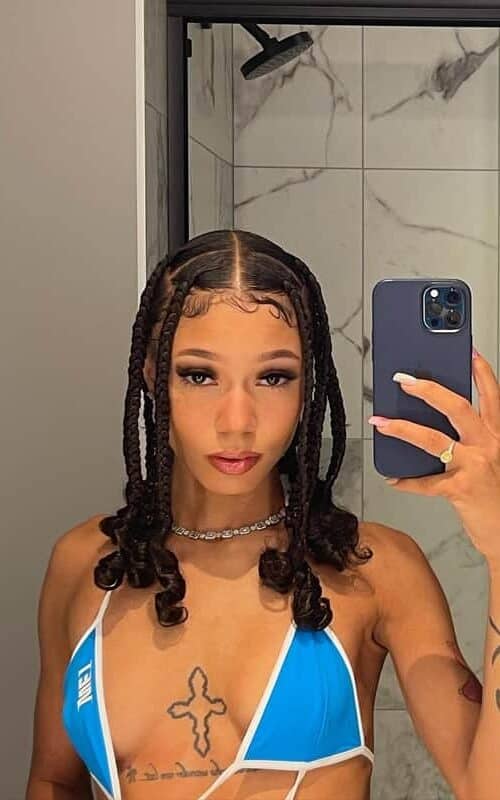Coi Leray braids with curly ends