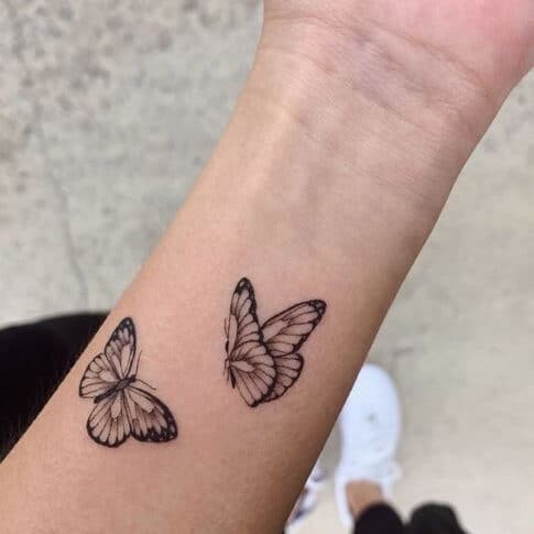 Small butterfly hand tattoo design
