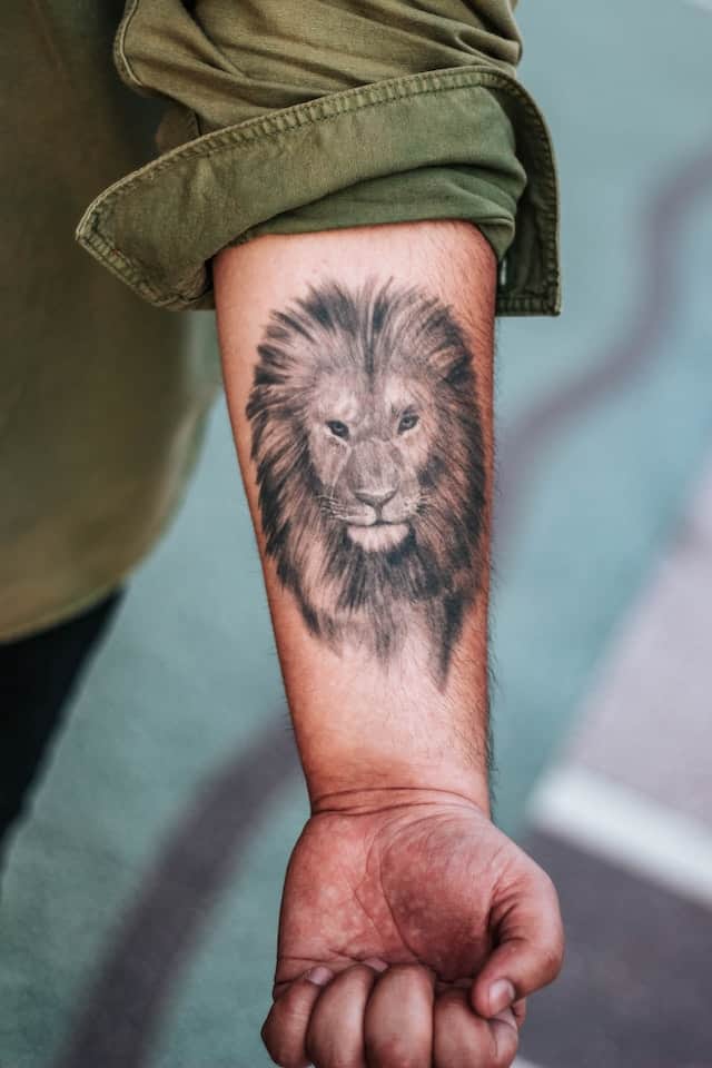 Lion forearm tattoo for men